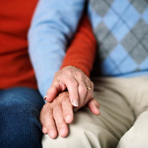 close-up-of-mature-couple-holding-hands